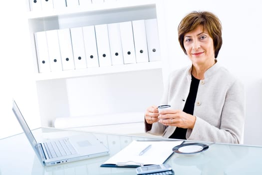 Senior businesswoman at desk