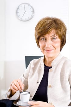 Businesswoman having coffee break