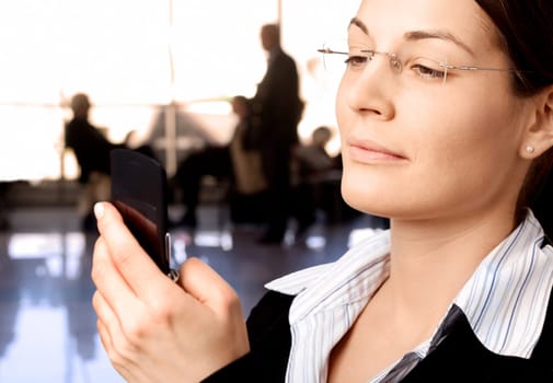 Businesswoman dials on cellphone