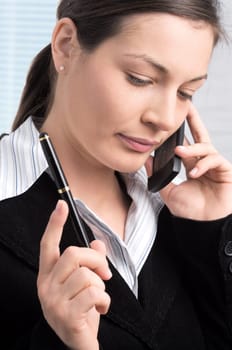 Businesswoman talks on mobile