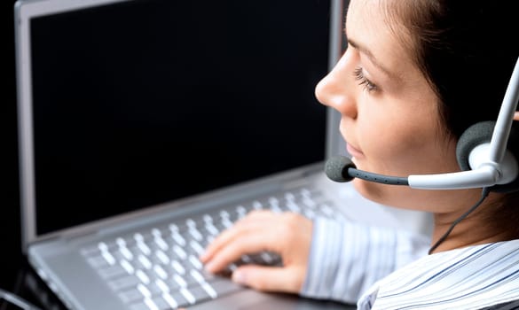 Operator works on laptop