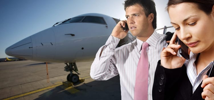 Businesspeople and corporate jet