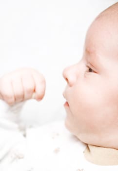 Baby looks his hand
