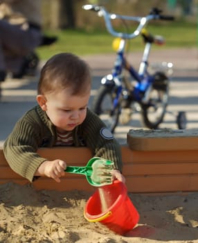 playing in sand pit