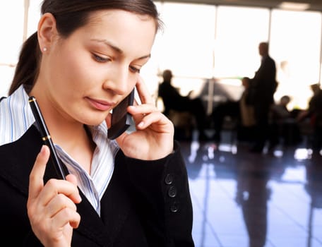 Businesswoman calls on cellphone