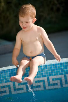 Baby boy on poolside
