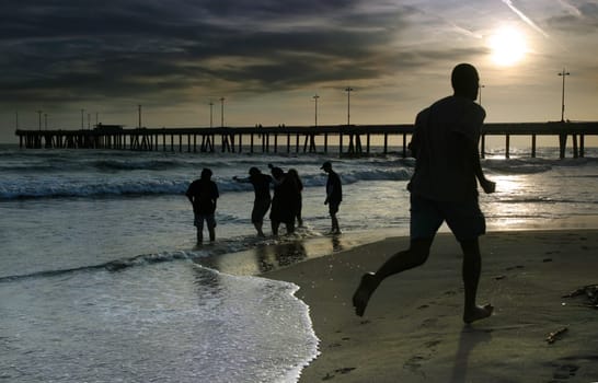 Man joggs on the beach