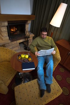 At home by the fireplace