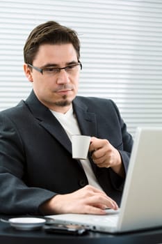 Businessman drinking coffee