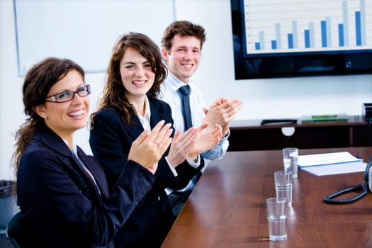 Businesspeople clapping on training