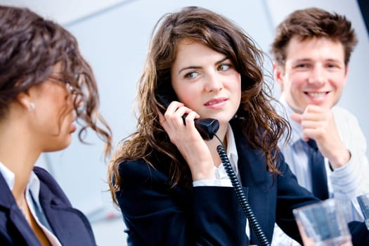Businesspeople calling on phone