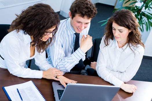 Businesspeople working on computer