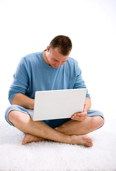 Young casual man with laptop