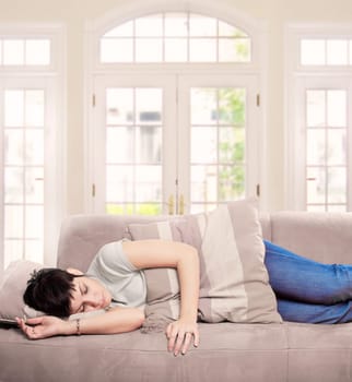 Young woman sleeps on the sofa