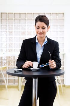 Businesswoman having coffee break