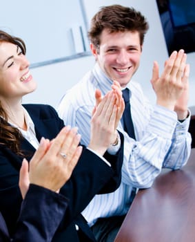 Clapping businesspeople