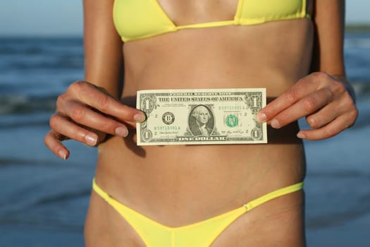 Woman showing dollar