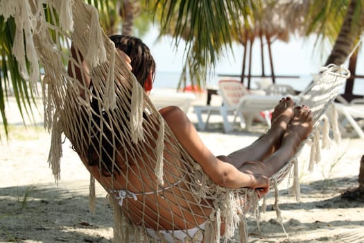 Woman sleeping in hammock