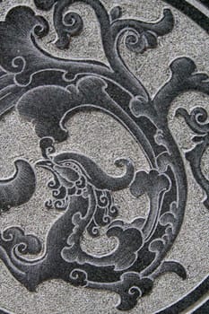 Asian pattern on a stone wall