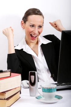 Businesswoman cheering on computer