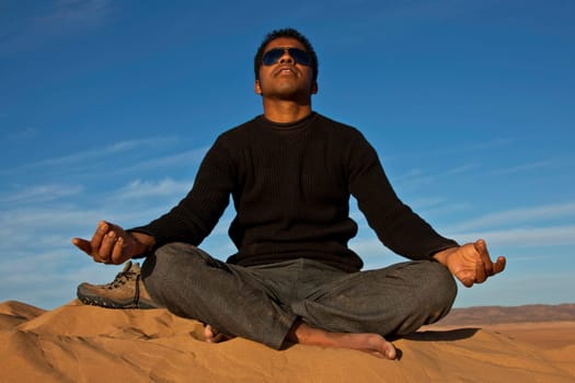 attractive young man meditating