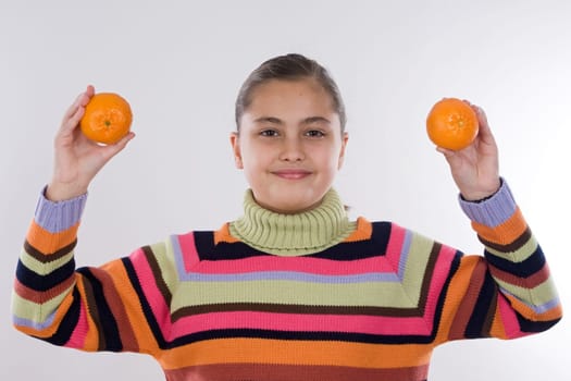Attractive girl with mandarines
