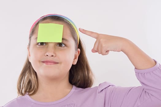 Adorable girl squint with post-it