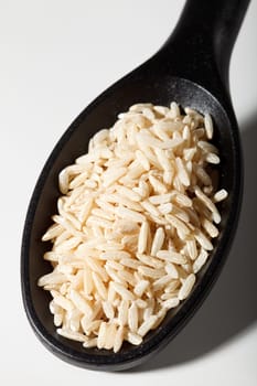 Brown rice on spoon