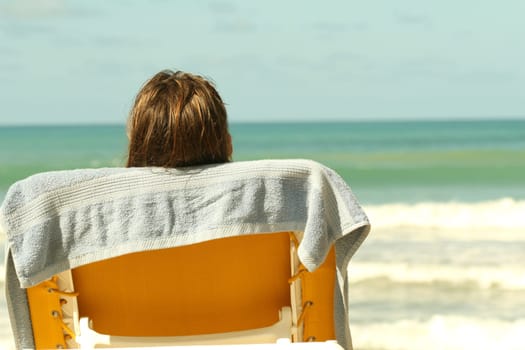Woman on the beach lounger