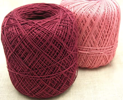 Balls of wool on a beige background