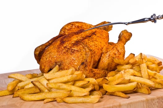 fried chicken with french fries served on wooden board