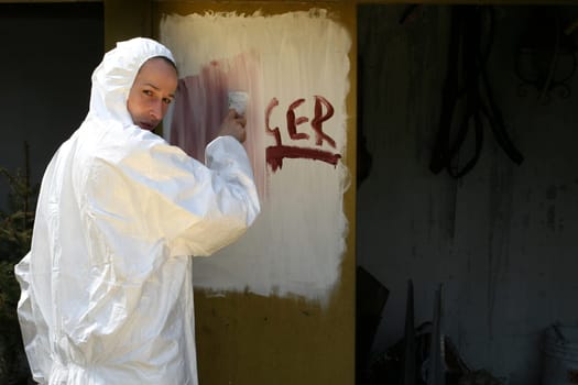 Woman paints over sign