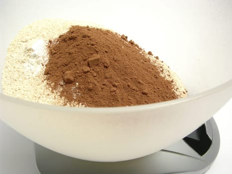Whole wheat flour,cocoa and baking powder for weighing on digital scales