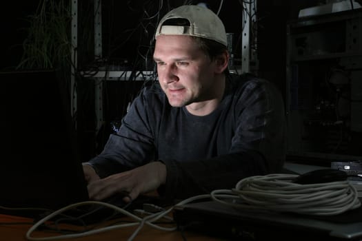 Computer hacker on computer