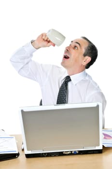 Overworked businessman at his desk on white background