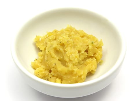Boiled red lentils in white porcelain bowl