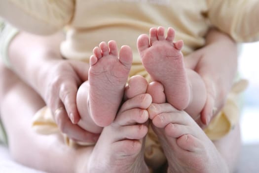 small childrens and adult mother foot