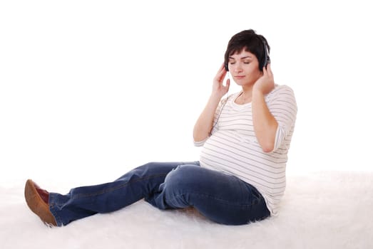 Pregnant woman listens to music