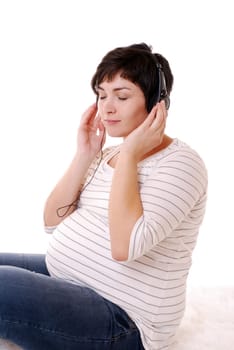 Pregnant woman listens to music
