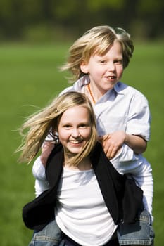 Siblings romping around