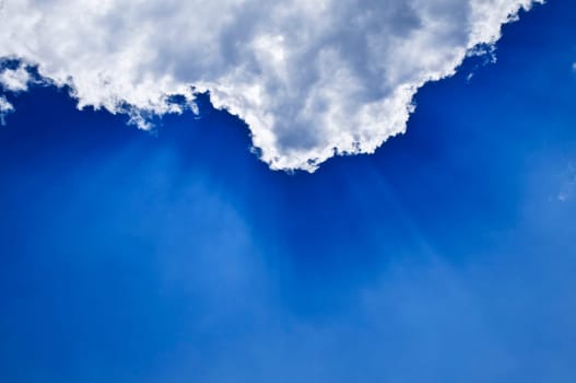 Blue sky with sunrays