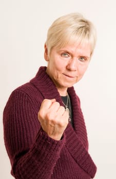 mature woman show the fist