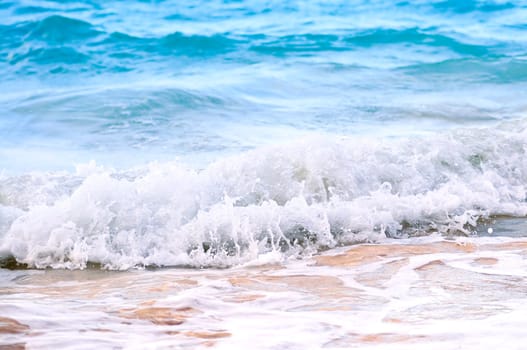 Waves breaking on tropical shore