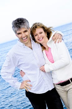 Mature romantic couple at seashore