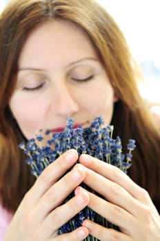 Woman smelling lavender