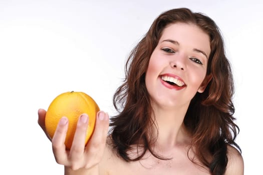 laughing woman with orange in her hand