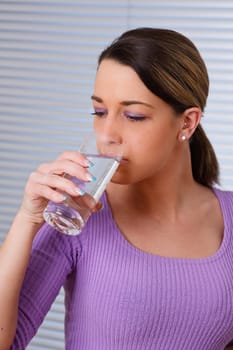 Woman drinking a glass of water