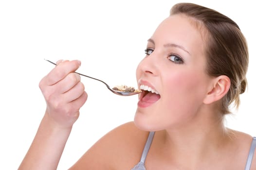 Young woman eating cereal