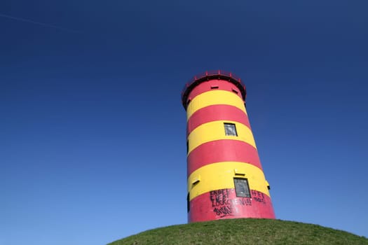 red-yellow lighthouse Krummhörn-Pilsum