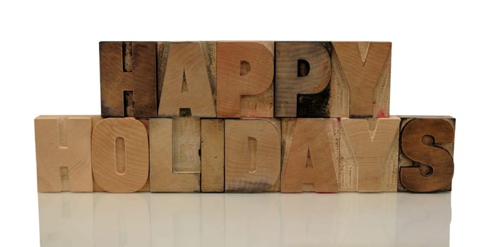 happy holidays in letterpress wood type